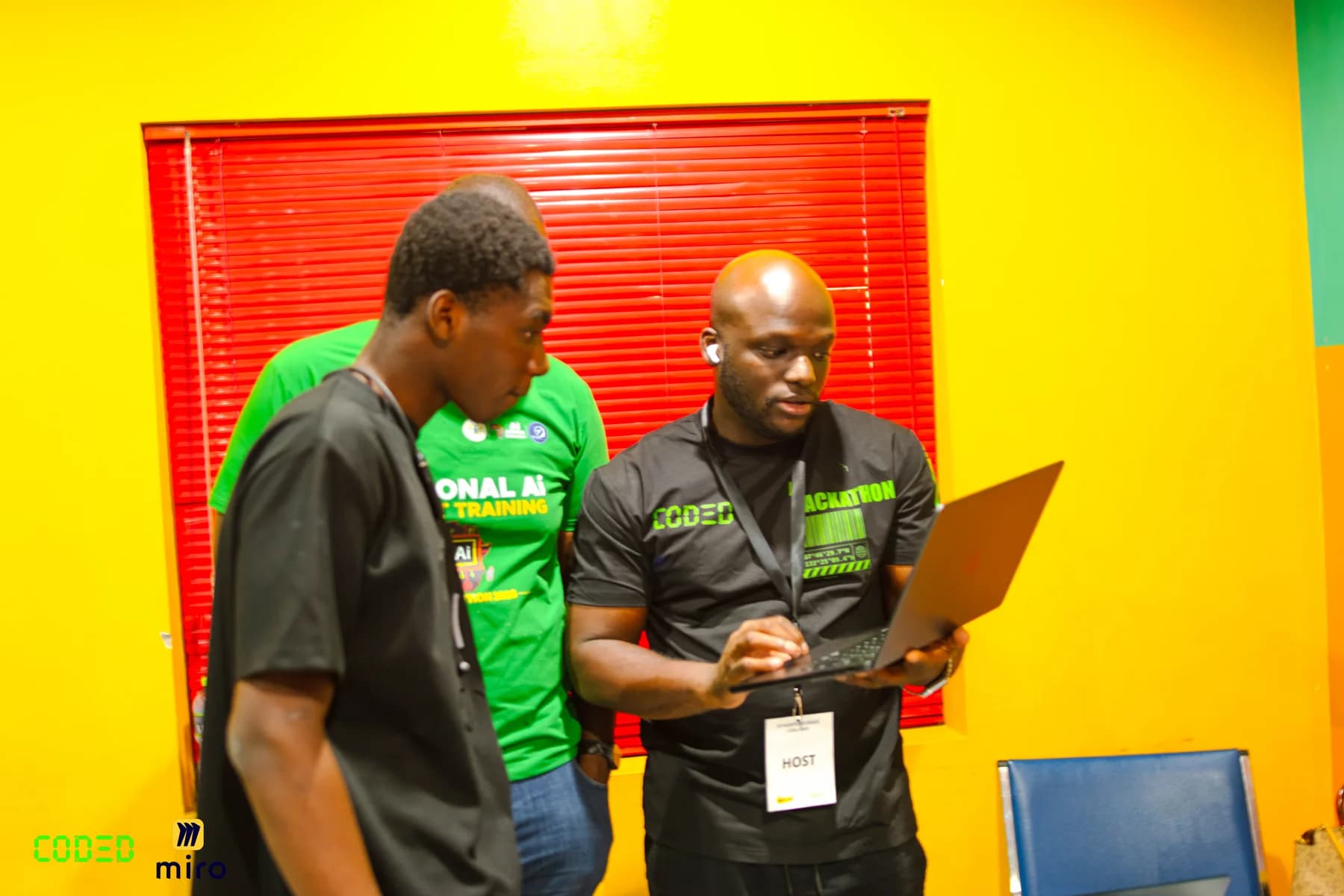 Community members reviewing a laptop together